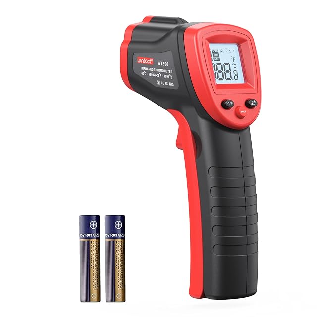 Wintact WT320 infrared thermometer aimed at a radiator, laser dot visible