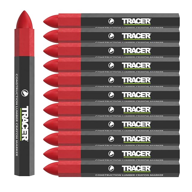 Tracer red wax marking crayons laid on a damp timber board